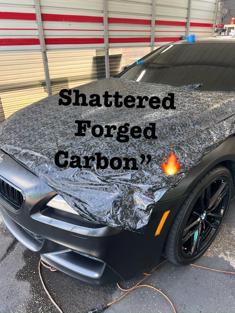 BMW M6 with a shattered forged carbon hood wrap